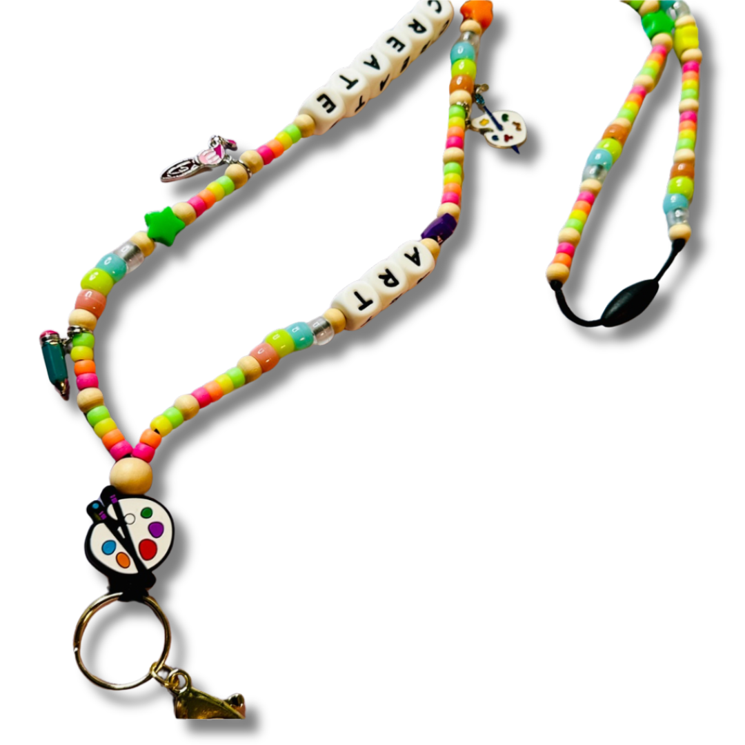 Vibrant beaded lanyard for art teachers featuring art-themed charms and colorful letter beads spelling CREATE ART