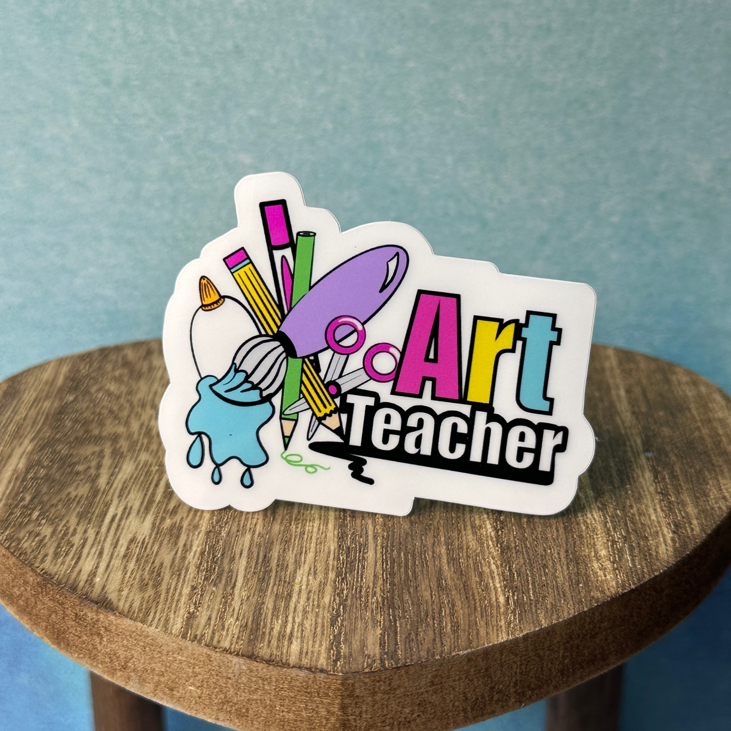 Detailed view of the art teacher sticker design featuring creative typography and educational theme.