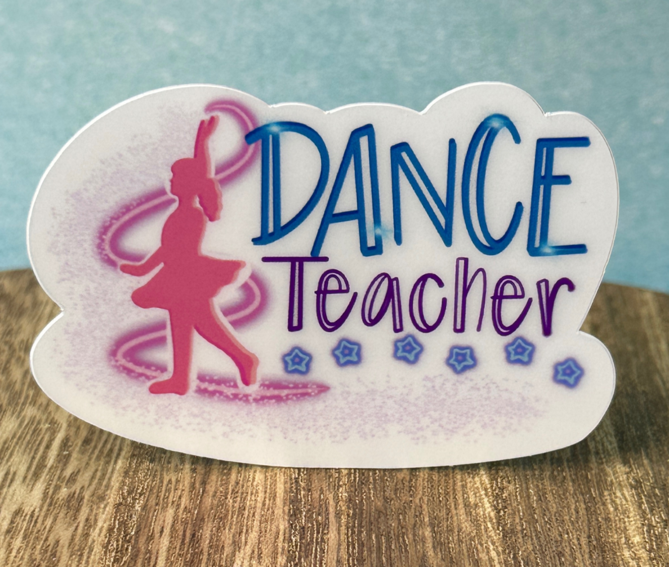 Close-up of Dance Teacher sticker with hand-drawn woman in pink dress dancing and cute lettered text.