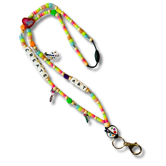 Colorful handmade art teacher lanyard with paint palette charms, CREATE ART letter beads, and breakaway safety clasp