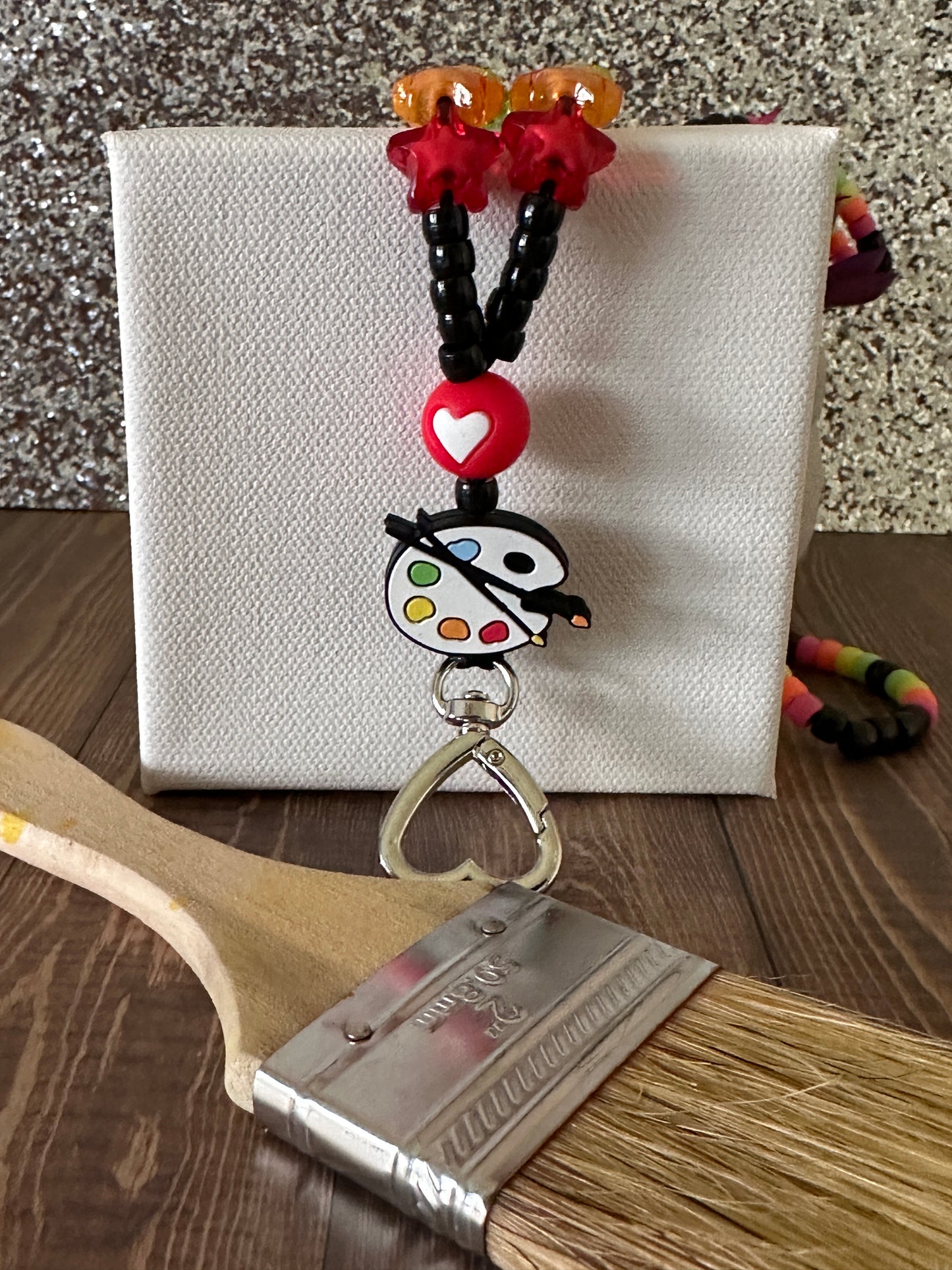 Art teacher lanyard with blank canvas and paintbrush highlighting artistic appeal for Art Teachers.

