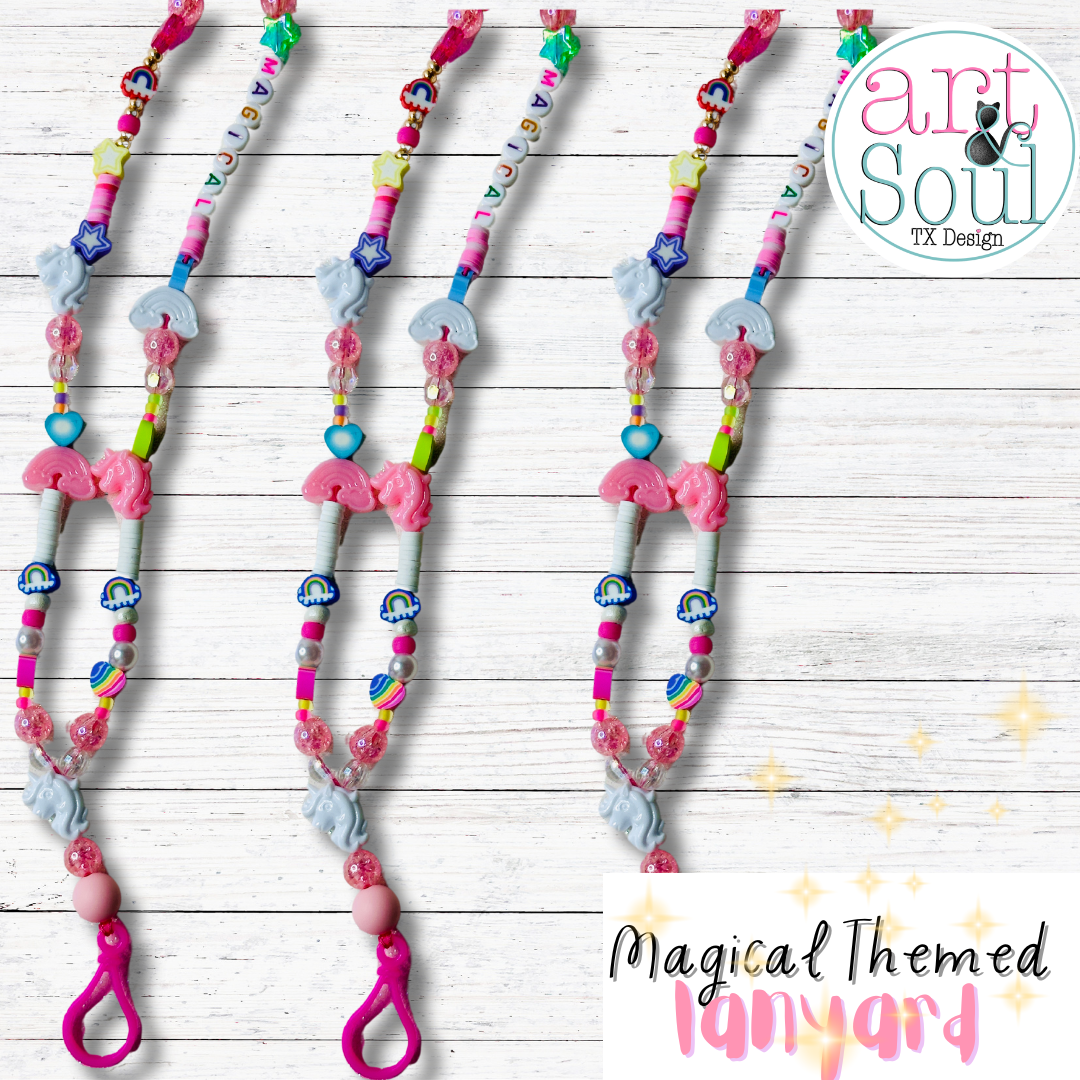 Three Magical Unicorn Lanyards laying next to each other on a white table top.