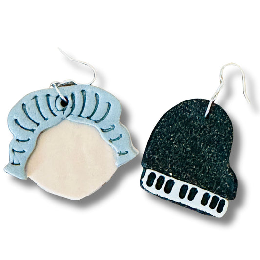 Two unique earrings with abstract designs on a white background