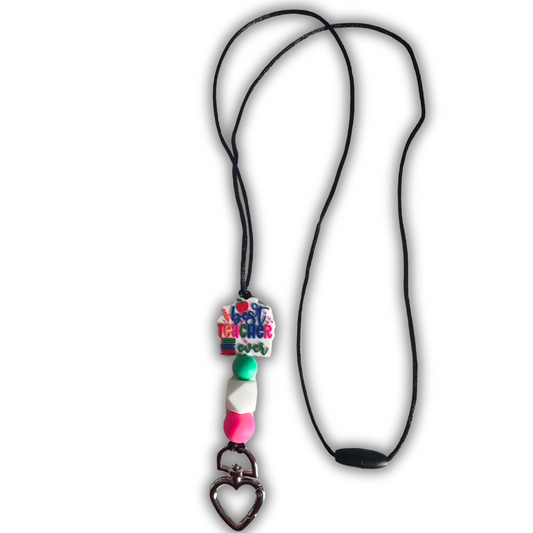A lanyard with a round multicolored badge holder attached to a black cord, featuring a heart-shaped clip at the bottom.