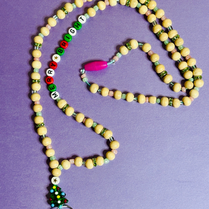 The Christmas Tree version of the Christmas Lanyard with a focus on the beaded words "MERRY AND BRIGHT".