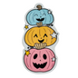 A set of three cartoon-style stickers depicting smiling jack-o-lanterns with faces in blue, orange, and pink.