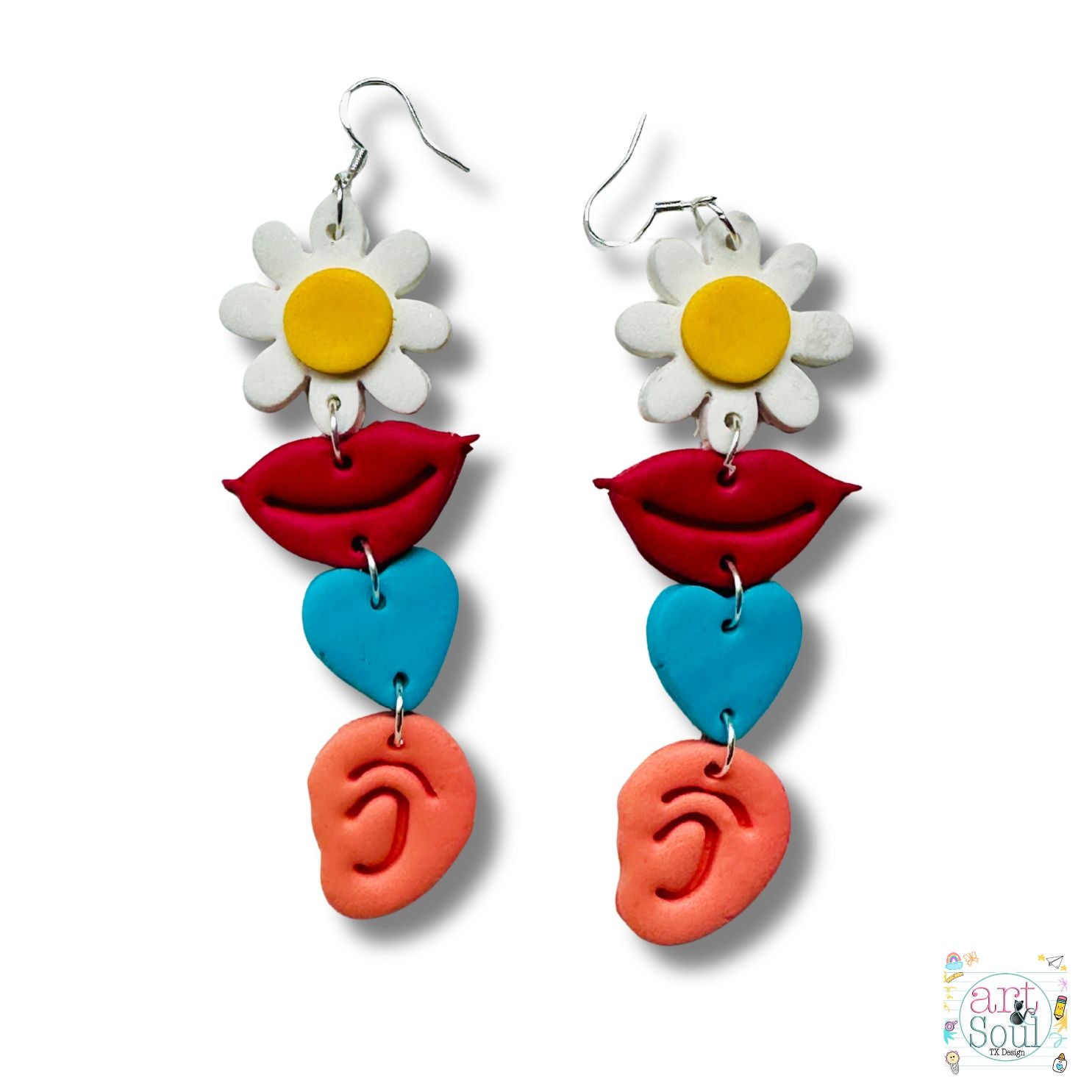 Colorful earrings with floral, lip, heart, and ear designs on a white background.