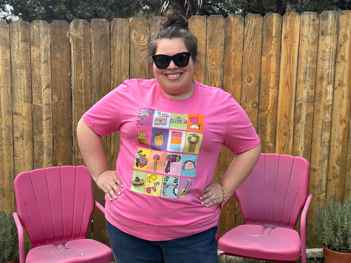 Close up of woman in sunglasses wearing the Fiesta San Antonio Lotería shirt. 