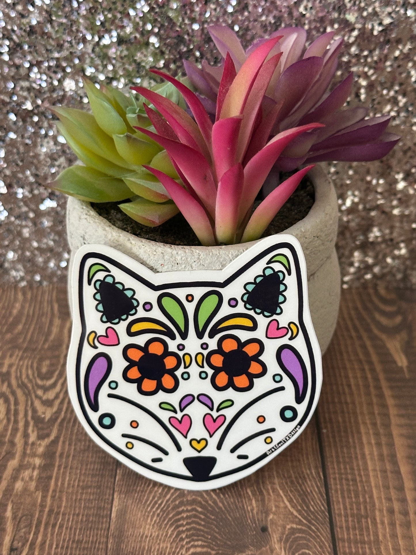 Fox sugar skull waterproof vinyl sticker displayed with succulent plant, hand-drawn Dia de los Muertos design for teachers.