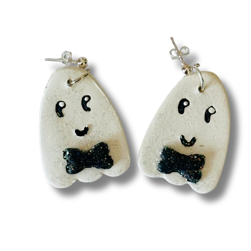 Handmade friendly ghost earrings on white background with cute bowties, hand-drawn smiles and eyes, polymer clay Halloween jewelry.