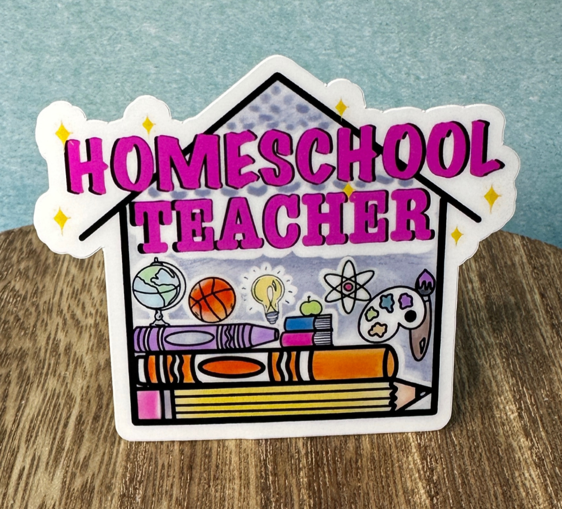 Homeschool Teacher waterproof vinyl sticker displayed on a wooden table in front of a blue wall.