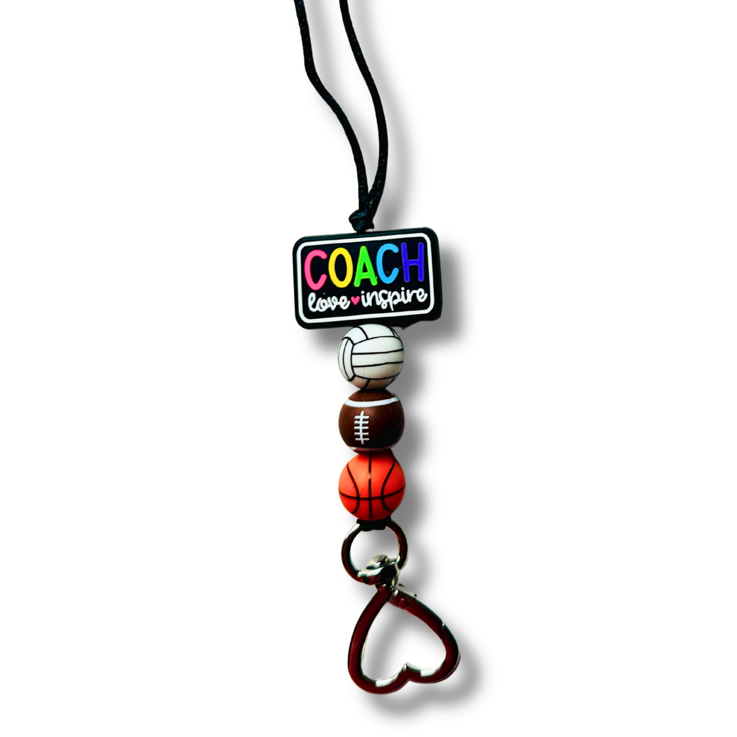 Lanyard with sports-themed beads and 'COACH' tag on a white background