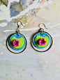 A pair of Monet Water Lily earrings on a colorful and abstract background.
