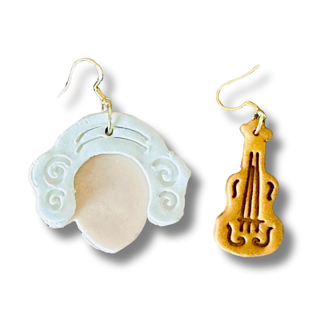 Two unique earrings, Mozart on left and Gold Violin on the right on a white background.