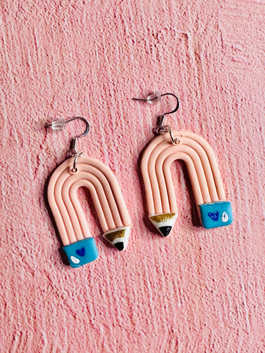 A close up of the Pink Pencil Teacher Earrings.  Each pencil is pink with a blue eraser.