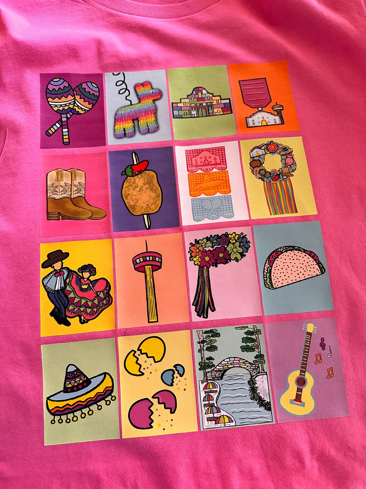 Close-up of San Antonio Lotería shirt design showing detailed Mexican lotería cards with iconic San Antonio symbols and Fiesta imagery.