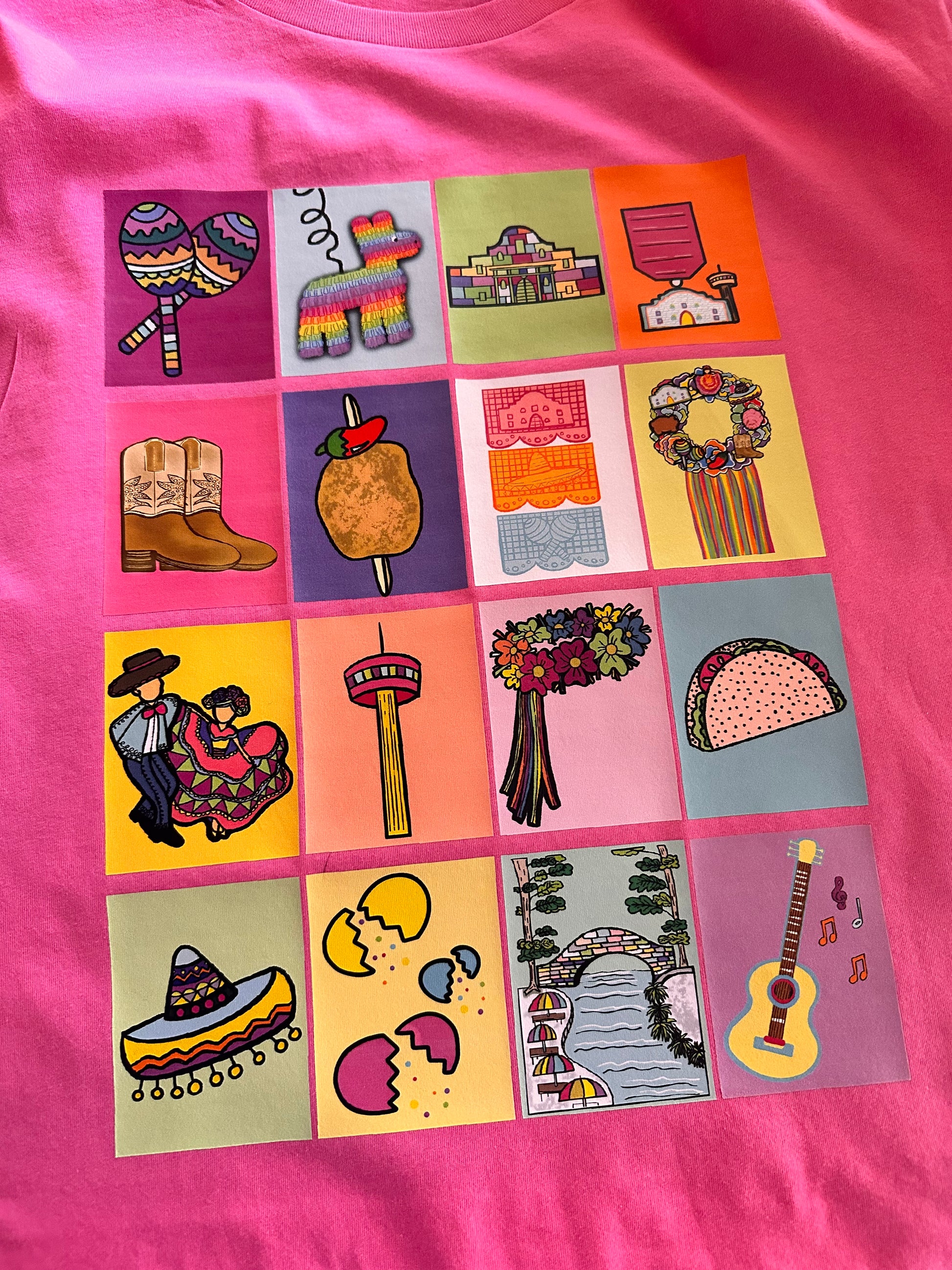 Close-up of San Antonio Lotería shirt design showing detailed Mexican lotería cards with iconic San Antonio symbols and Fiesta imagery.