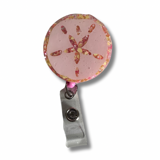 Sand Dollar badge reel perfect for teachers who love beach and ocean themes. Functional classroom accessory with retractable cord for ID badges and keys. Handcrafted design ideal for educators.