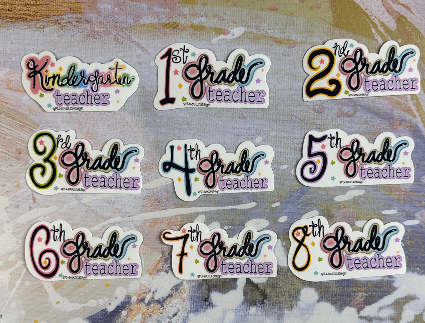 Teacher grade level vinyl stickers displayed on a colorful background showing grade styles from Kindergarten to Eighth Grade.
