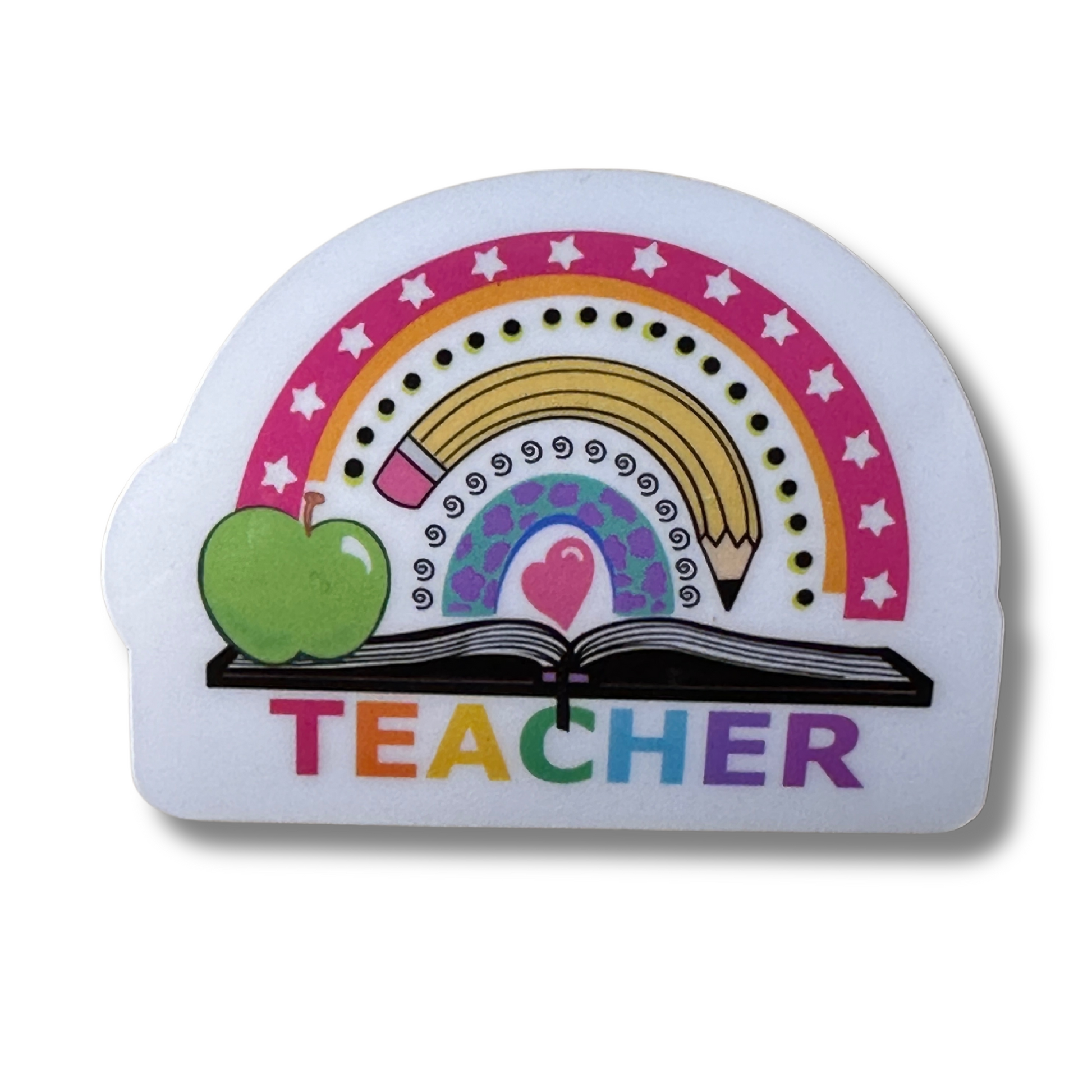 Close-up of Teacher Rainbow waterproof vinyl sticker on white background, showing rainbow, pencil, open book, and "TEACHER"in colorful font.