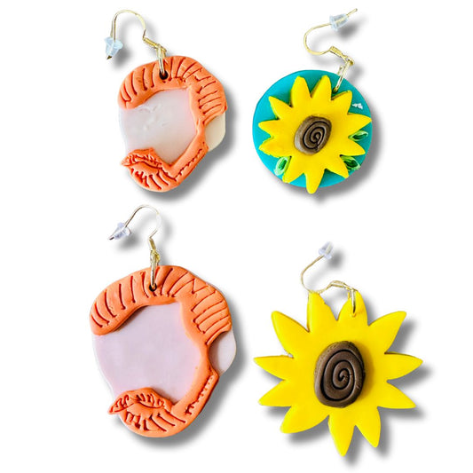 Two pairs of colorful Van Gogh earrings on a white background.  
Top row shows large earrings with Van Gogh's silhouette on the left and yellow sunflower on the right.  
Bottom row shows small earrings with Van Gogh's silhouette on the left and yellow sunflower on blue circle background on the right. 