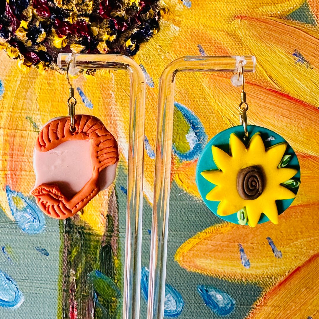 Detailed close up of Van Gogh sunflower earrings perfectly coordinated with vibrant Van Gogh style sunflower painting.