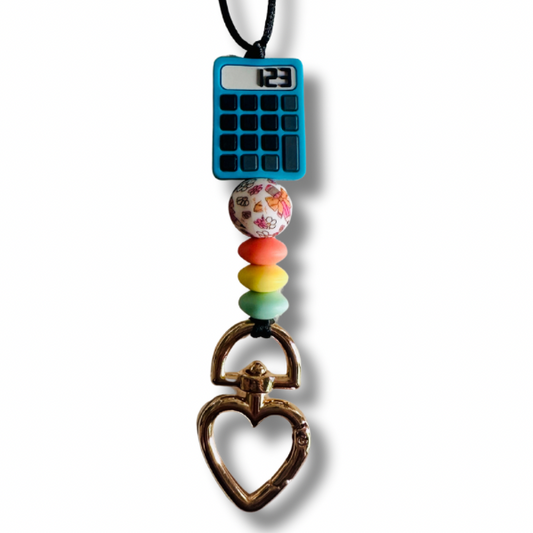 Close-up of red, yellow, and blue silicone beads and heart clasp on Math Teacher Lanyard