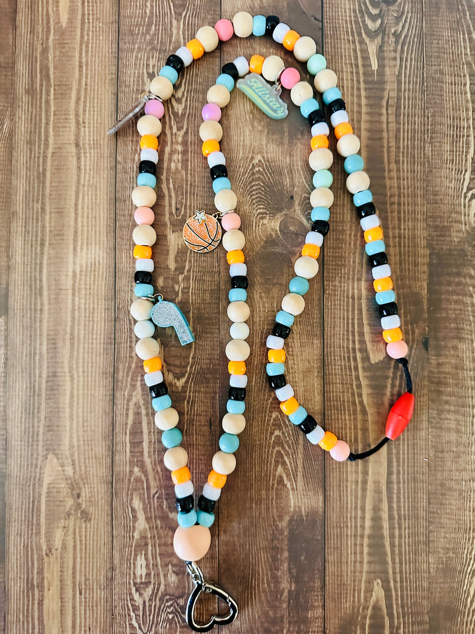 Physical Education teacher beaded lanyard sports charms teal orange wood beads on wooden table
