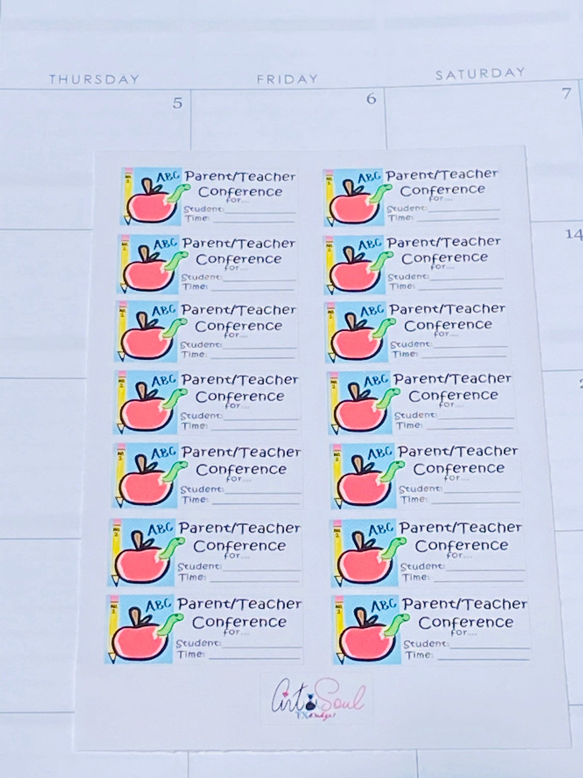 Full sheet of parent-teacher conference stickers placed inside a teacher planner, showing how sticker size compares to a planner cell.