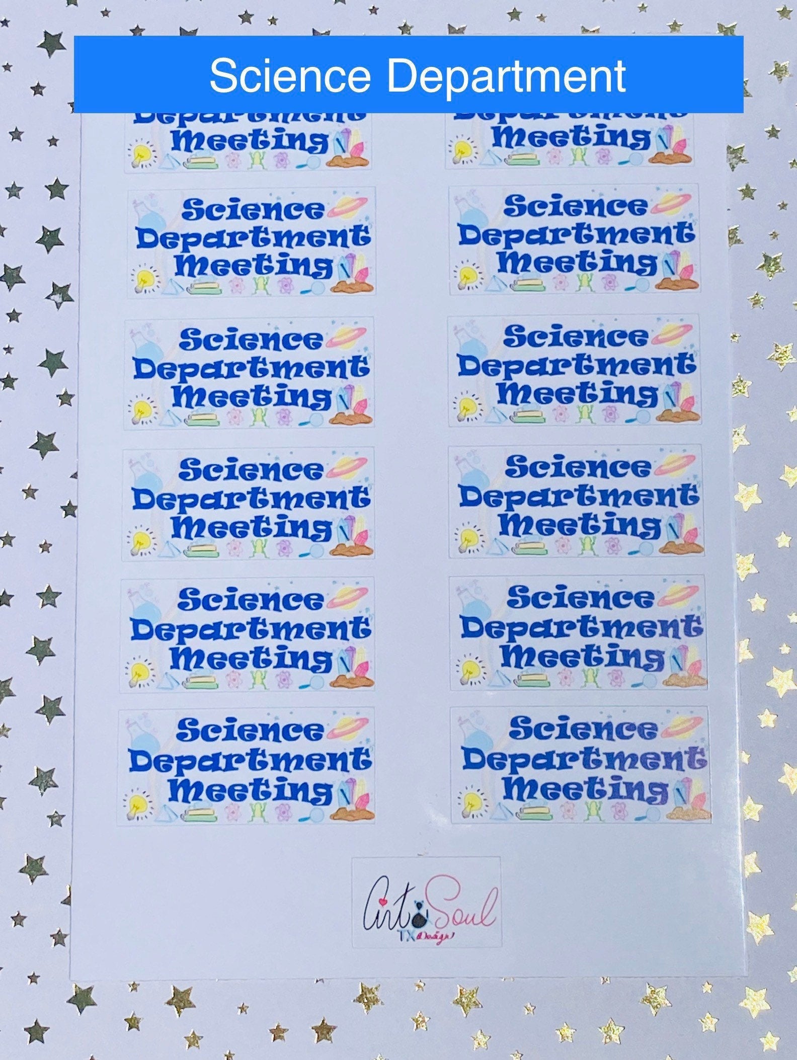 Close-up of science department meeting planner sticker on starry background showing blue text and science graphics.