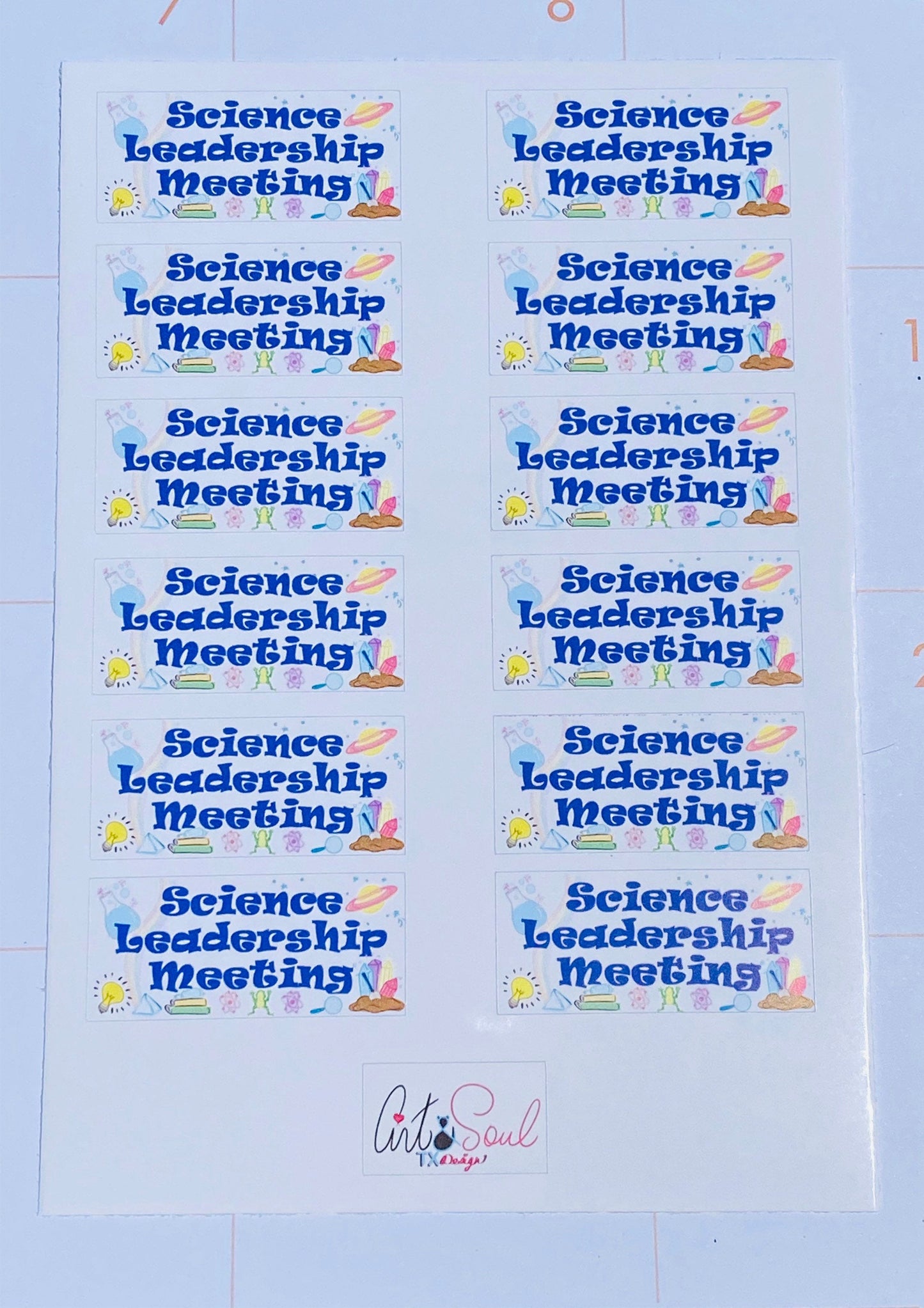 Science leadership meeting sticker sheet on teacher planner calendar page.